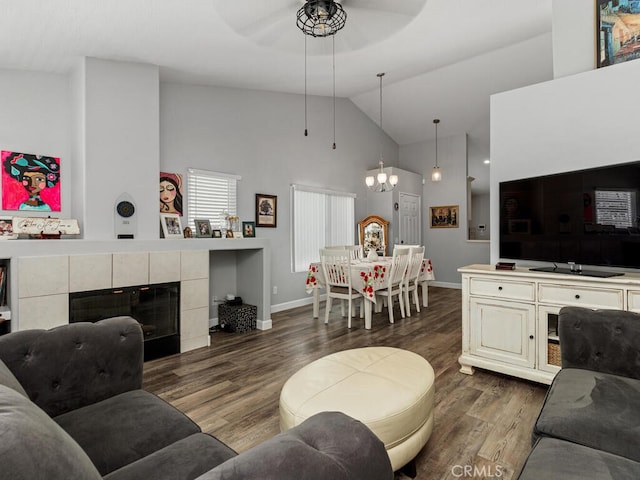 41187 Via Cedro, Murrieta, CA 92562 - living room featuring high vaulted ceiling, ceiling fan, wood finished floors, baseboards, and a chandelier