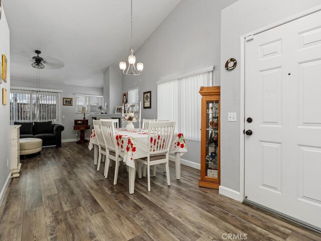 41187 Via Cedro, Murrieta, CA 92562 - dining area with a ceiling fan, dark wood finished floors, baseboards, a chandelier, and high vaulted ceiling