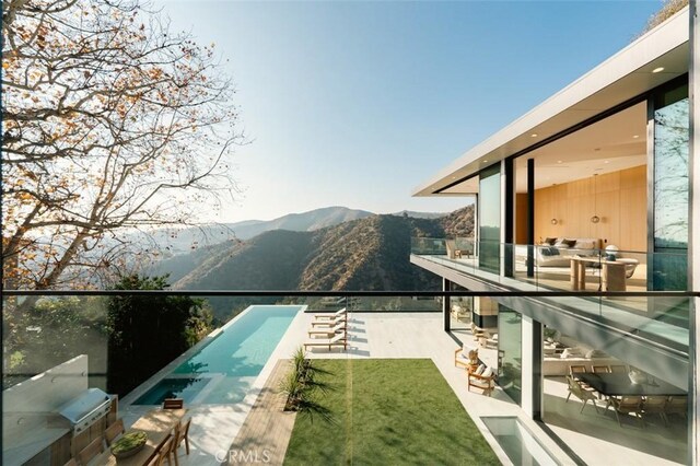 view of pool with a mountain view