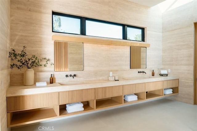 bathroom featuring backsplash and double vanity