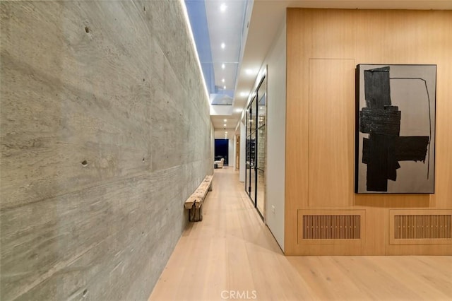 corridor featuring recessed lighting, wood finished floors, and visible vents