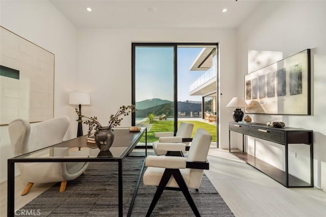 living area featuring recessed lighting and a mountain view