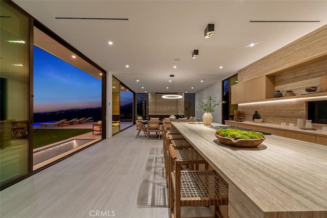 dining space with light wood-style floors and recessed lighting