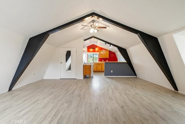 bonus room with light wood-style floors, lofted ceiling, and ceiling fan