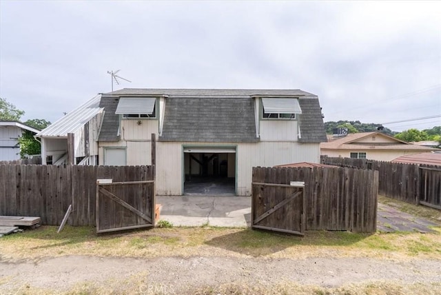 exterior space featuring fence and a gate