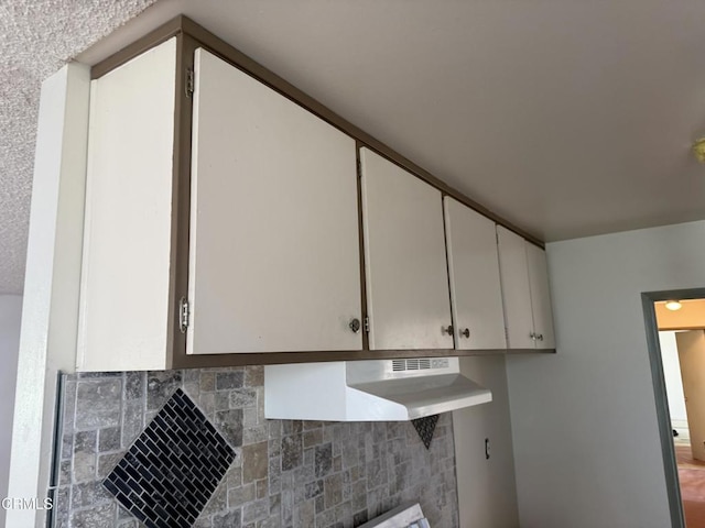 3700 Dean Dr Unit 3306, Ventura, CA 93003 - room details featuring decorative backsplash and under cabinet range hood