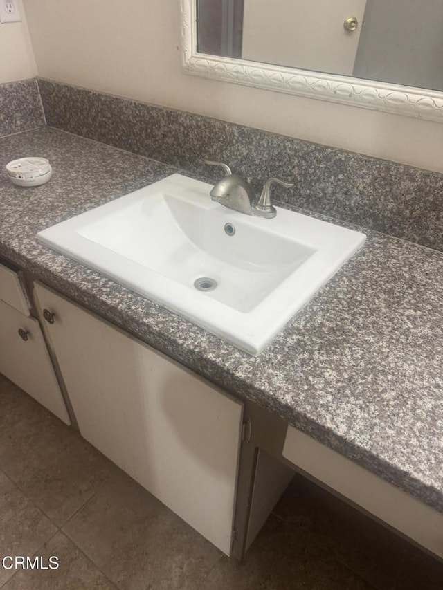 3700 Dean Dr Unit 3306, Ventura, CA 93003 - bathroom with vanity and tile patterned flooring