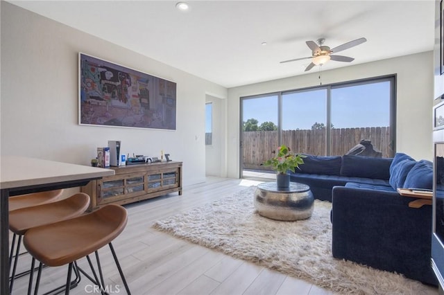 living room featuring a ceiling fan, wood finished floors, and recessed lighting