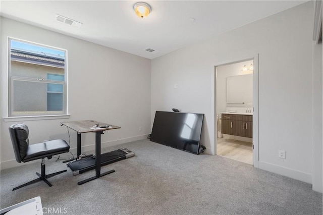 interior space with visible vents, baseboards, and carpet flooring