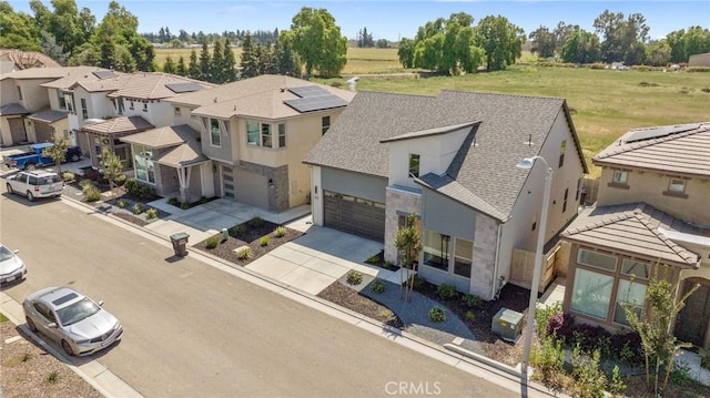 birds eye view of property with a residential view