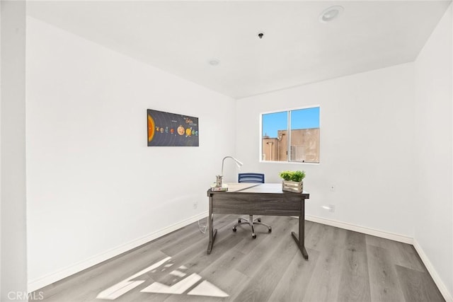 office with baseboards and wood finished floors