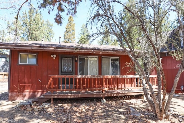 view of front of property featuring a wooden deck