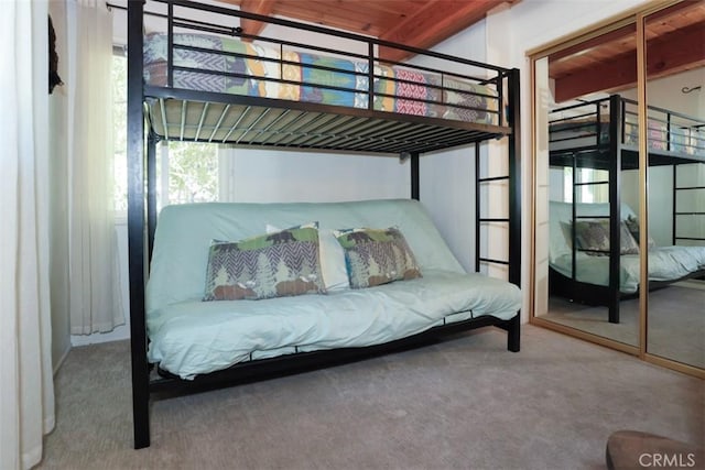 carpeted bedroom featuring a closet