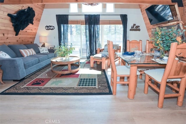 living area featuring wood walls and wood finished floors