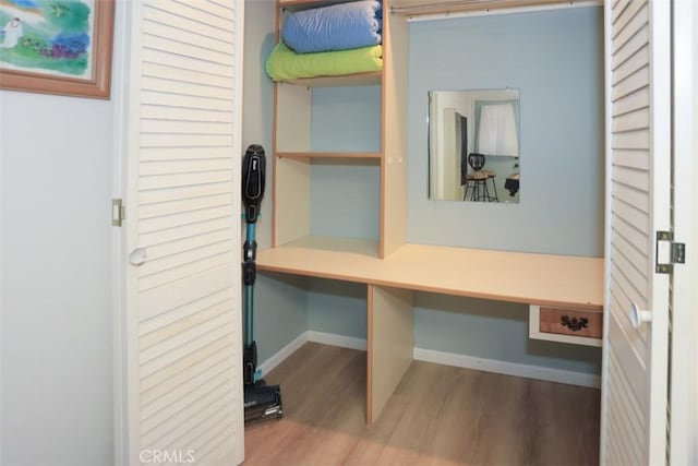 mudroom with baseboards and wood finished floors