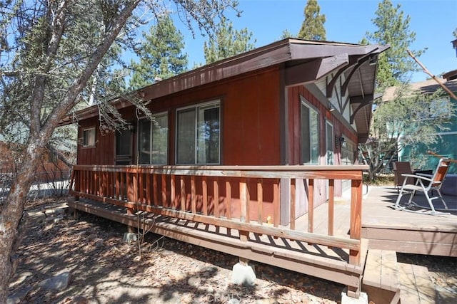 view of side of home featuring a deck