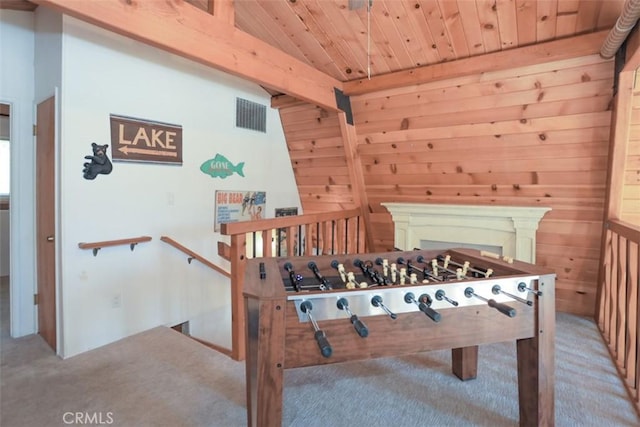 playroom with wooden walls, carpet, visible vents, and wood ceiling
