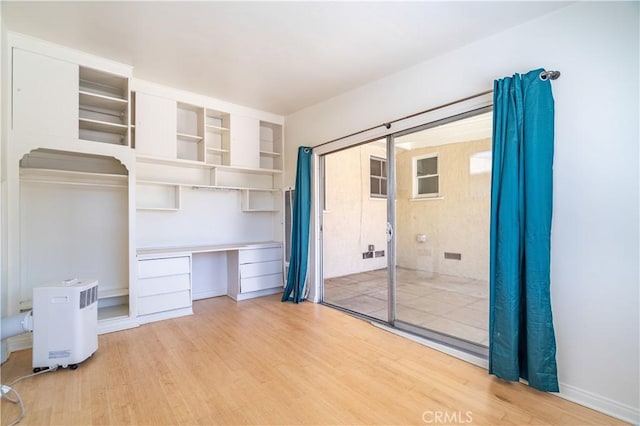2935 Westwood Blvd, West Los Angeles, CA 90064 - unfurnished bedroom featuring light wood finished floors and built in study area