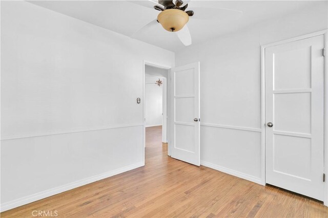 2935 Westwood Blvd, West Los Angeles, CA 90064 - unfurnished bedroom featuring baseboards, a ceiling fan, and wood finished floors