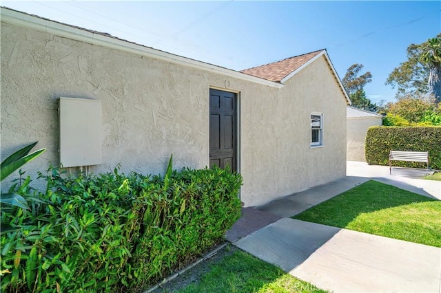 2935 Westwood Blvd, West Los Angeles, CA 90064 - view of home's exterior featuring a lawn and stucco siding