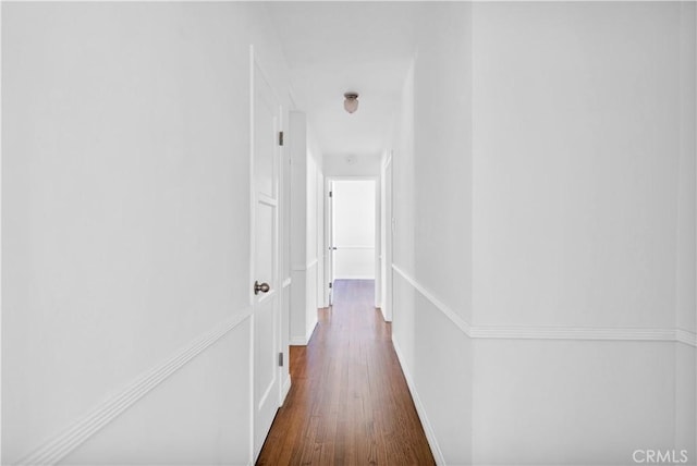2935 Westwood Blvd, West Los Angeles, CA 90064 - corridor with baseboards and dark wood-type flooring
