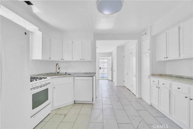 2935 Westwood Blvd, West Los Angeles, CA 90064 - kitchen with white cabinets, marble finish floor, a sink, and white appliances