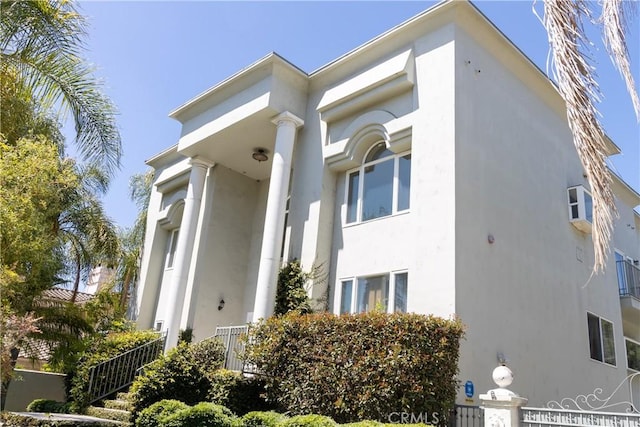 view of side of property featuring stucco siding