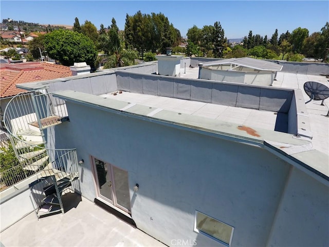 back of property featuring stucco siding
