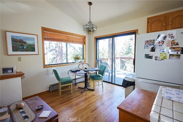 1612 Linden Dr, Pine Mountain Club, CA 93222 - dining room with baseboard heating, lofted ceiling, light wood finished floors, and baseboards
