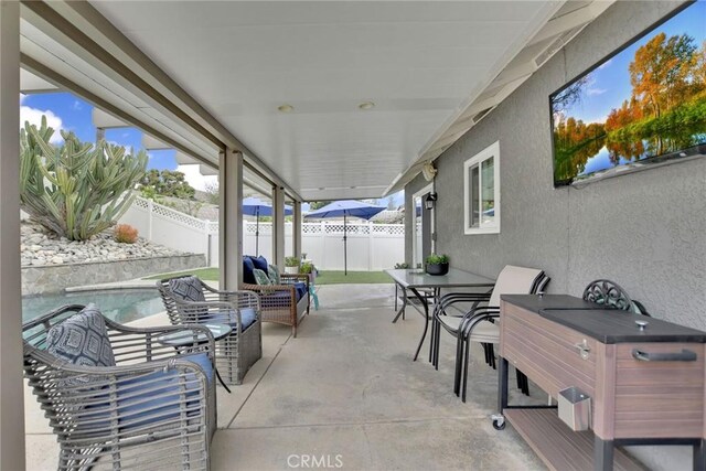 10830 Sundance Dr, Rancho Cucamonga, CA 91730 - view of patio / terrace featuring outdoor dining space, a fenced in pool, and a fenced backyard