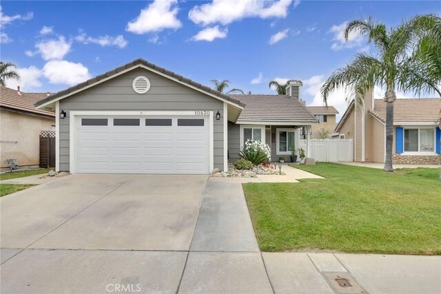 10830 Sundance Dr, Rancho Cucamonga, CA 91730 - single story home with concrete driveway, a front lawn, a tiled roof, an attached garage, and fence