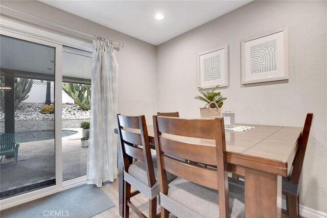 10830 Sundance Dr, Rancho Cucamonga, CA 91730 - dining room with recessed lighting, wood finished floors, and baseboards