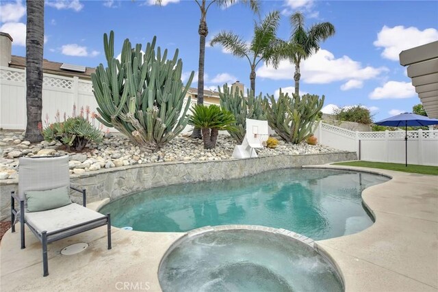 10830 Sundance Dr, Rancho Cucamonga, CA 91730 - view of pool with a fenced backyard, a patio, and a pool with connected hot tub