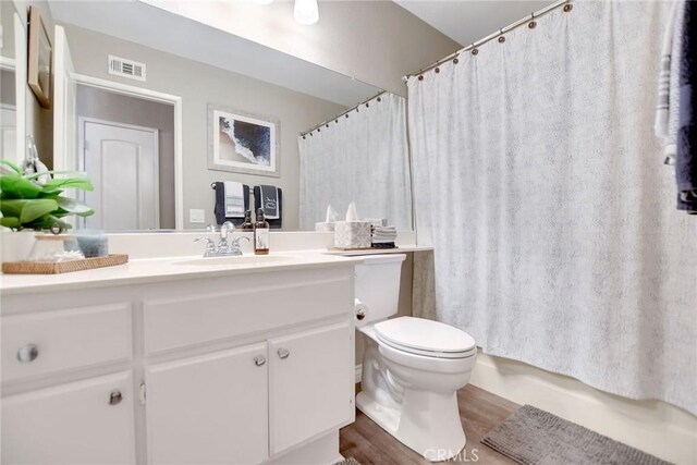 10830 Sundance Dr, Rancho Cucamonga, CA 91730 - full bathroom featuring wood finished floors, visible vents, vanity, and toilet