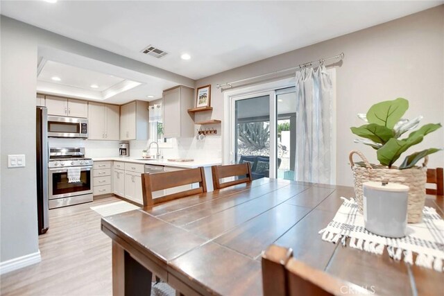 10830 Sundance Dr, Rancho Cucamonga, CA 91730 - interior space with light wood-type flooring, a tray ceiling, visible vents, and recessed lighting