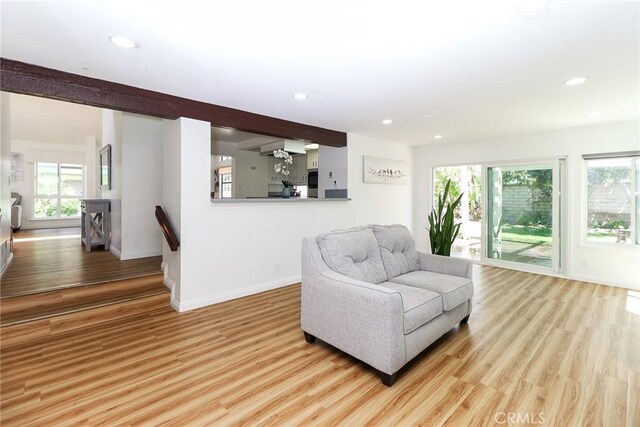 8288 Mercury Dr, Buena Park, CA 90620 - living area featuring healthy amount of natural light, light wood-type flooring, baseboards, and recessed lighting