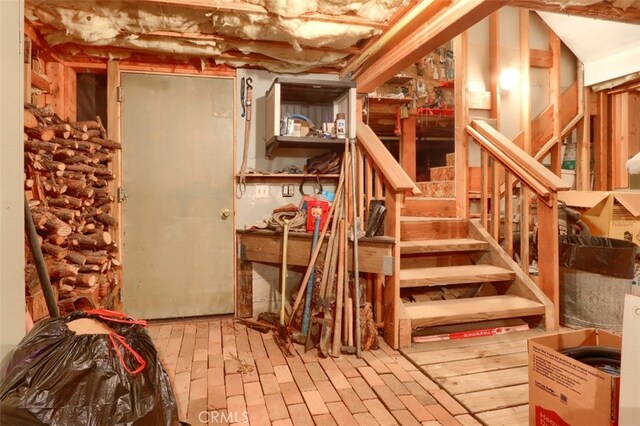 unfinished below grade area featuring stairway