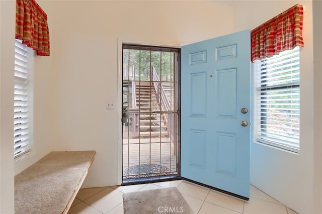 entryway with light tile patterned floors