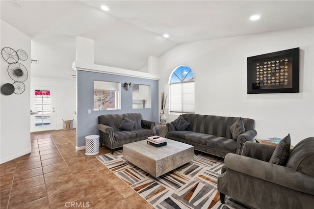 tiled living area featuring lofted ceiling, plenty of natural light, and recessed lighting