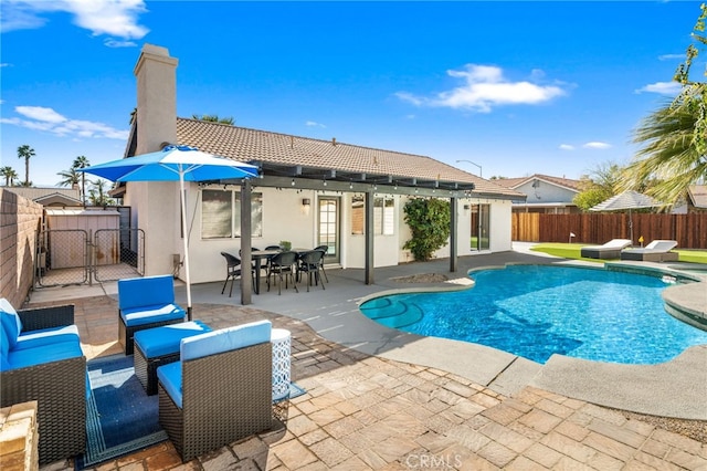 view of pool featuring a gate, a patio area, outdoor lounge area, a fenced backyard, and a fenced in pool