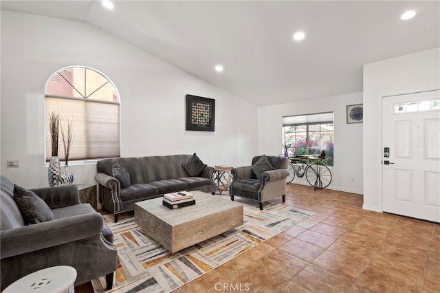 living area with lofted ceiling, baseboards, and recessed lighting