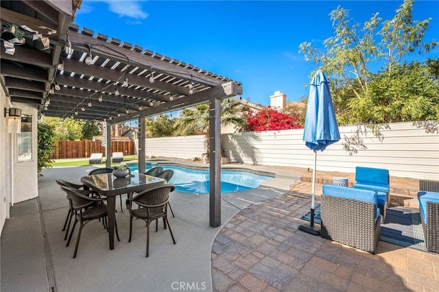 view of patio featuring a pergola, a fenced in pool, outdoor dining space, and a fenced backyard
