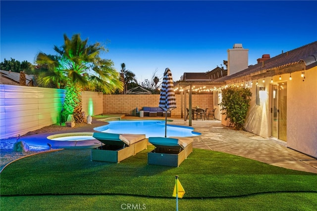 view of swimming pool featuring a fenced backyard, a patio, a fenced in pool, and an in ground hot tub