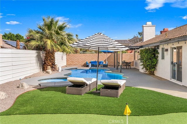 view of pool with a fenced in pool, a patio, a fenced backyard, and an in ground hot tub