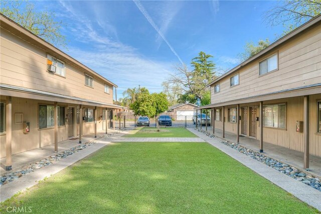 view of yard with fence and a patio