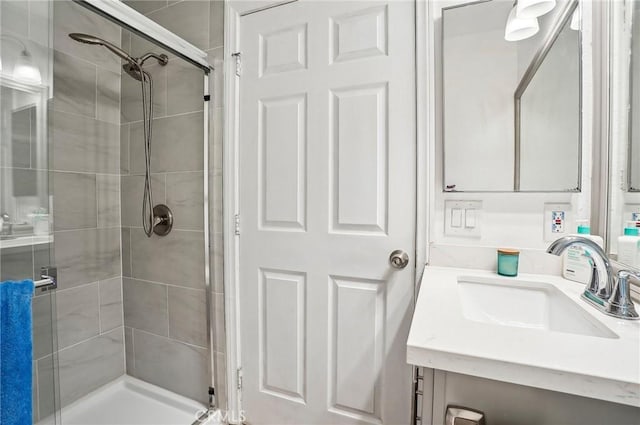 full bathroom with vanity and a stall shower