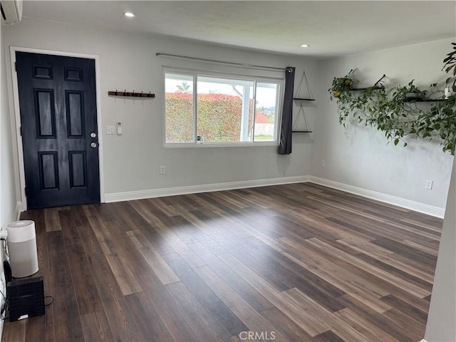 1176 Waxwing Dr, Vista, CA 92083 - foyer with an AC wall unit, dark wood finished floors, recessed lighting, and baseboards