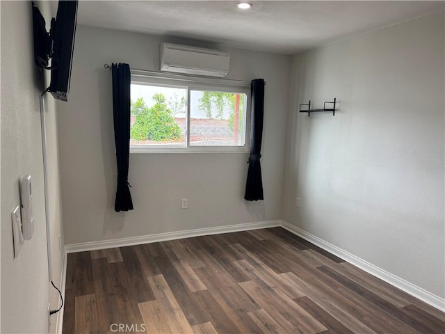 1176 Waxwing Dr, Vista, CA 92083 - unfurnished room with a wall mounted air conditioner, dark wood-style floors, baseboards, and recessed lighting