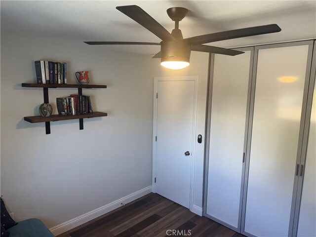 1176 Waxwing Dr, Vista, CA 92083 - unfurnished bedroom with dark wood-type flooring, baseboards, and a ceiling fan