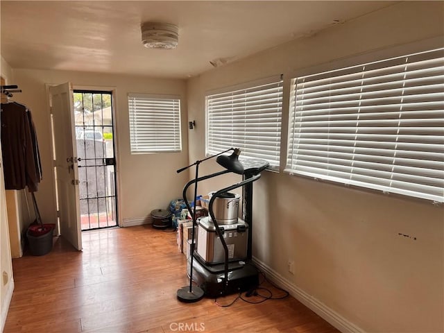 1423 S Poinsettia Ave, Compton, CA 90221 - exercise area with baseboards and light wood-style flooring